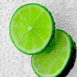 close up of lime slices in fizzy soda