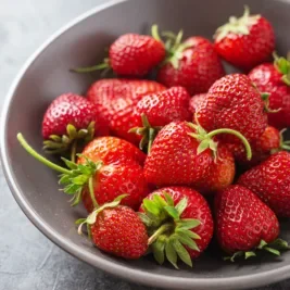 Grey bowl filled with strawberries.