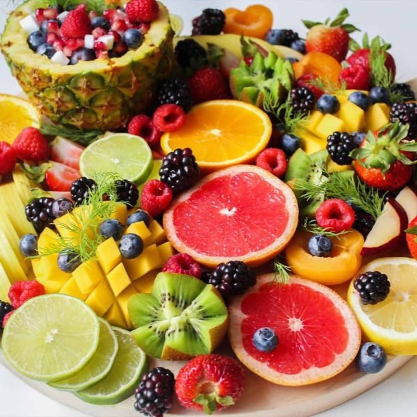 Plate of assorted colourful fruits.
