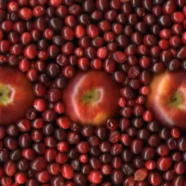apples in a pool of cranberries