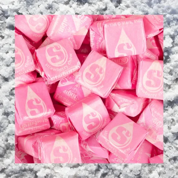 Pink Starburst candies with a salt border.