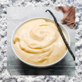 A bowl of creamy vanilla custard with a border of salt.