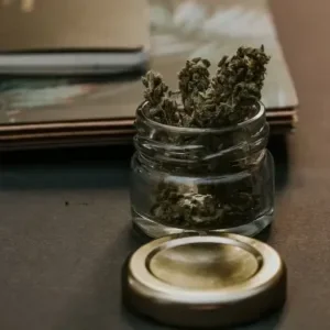 Dry herb in a small jar (Weed Flower).